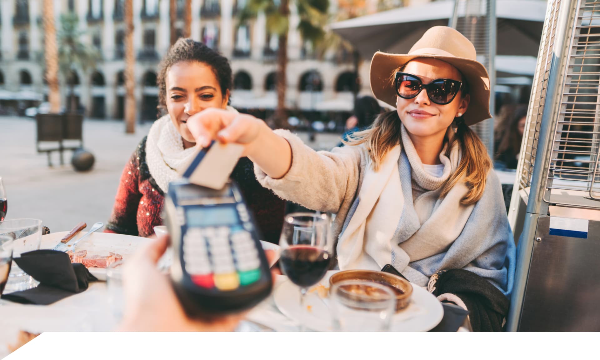 two women out together with drinks
