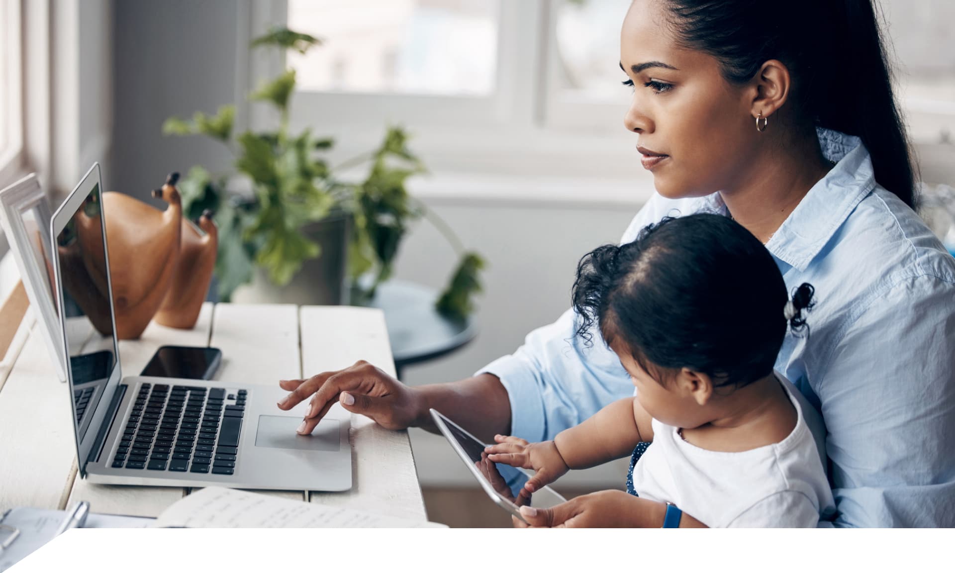 woman at computer with baby